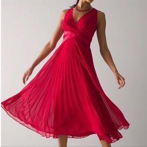 Gorgeous red midi dress with playful pleats. This stunning dress is NWT.
